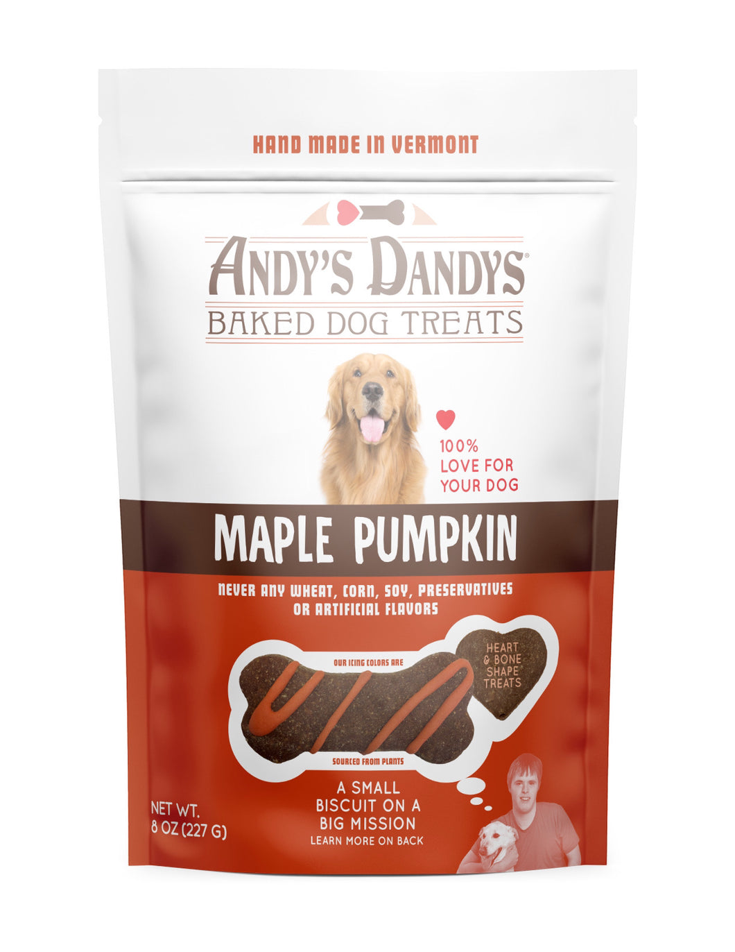 Front of white and orange pouch of tasty Andy’s Dandys Maple Pumpkin flavor mini bone shaped baked dog biscuits drizzled with orange yogurt icing